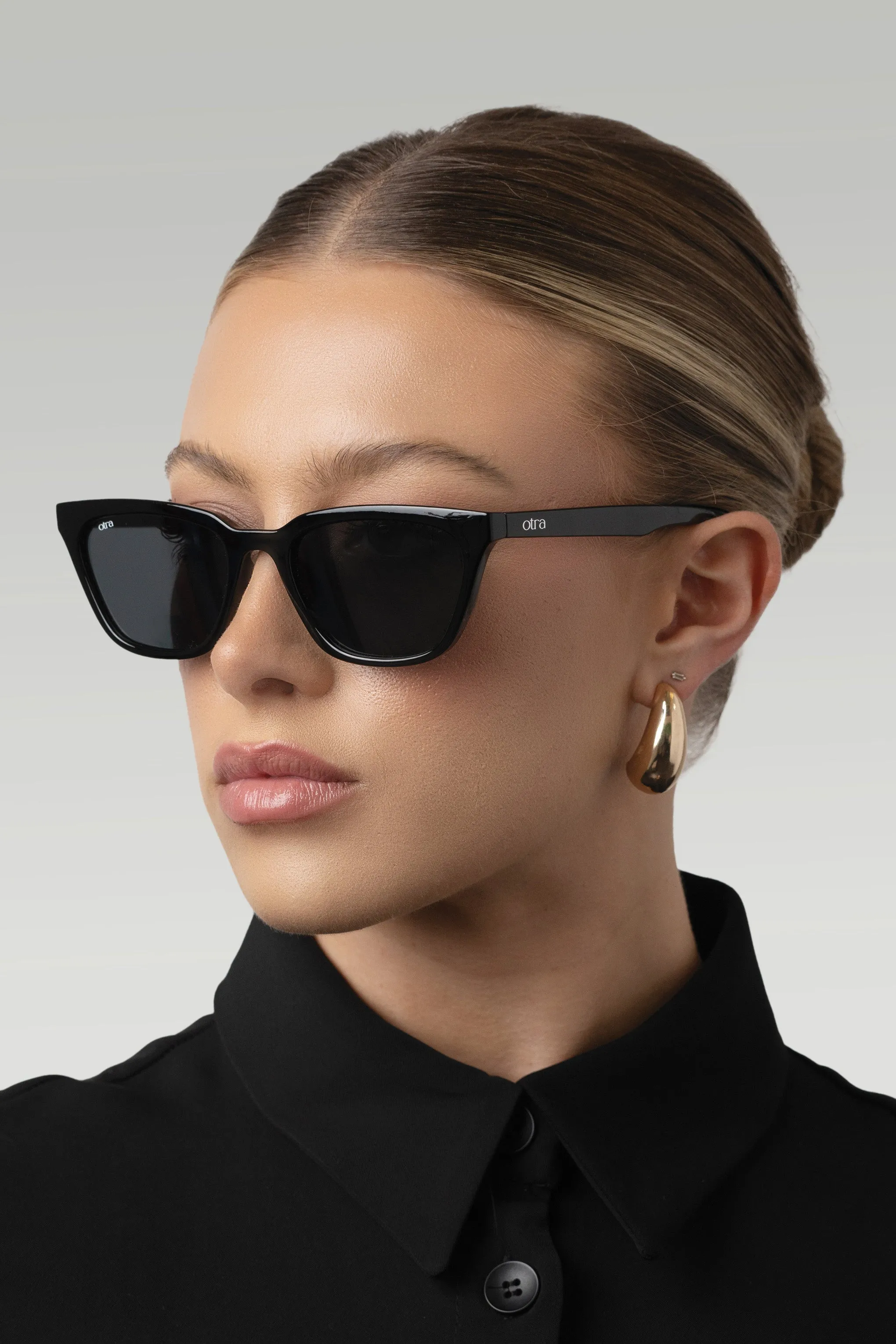 Seva | Otra Black Rounded Slim Cat Eye Sunglasses Club L London